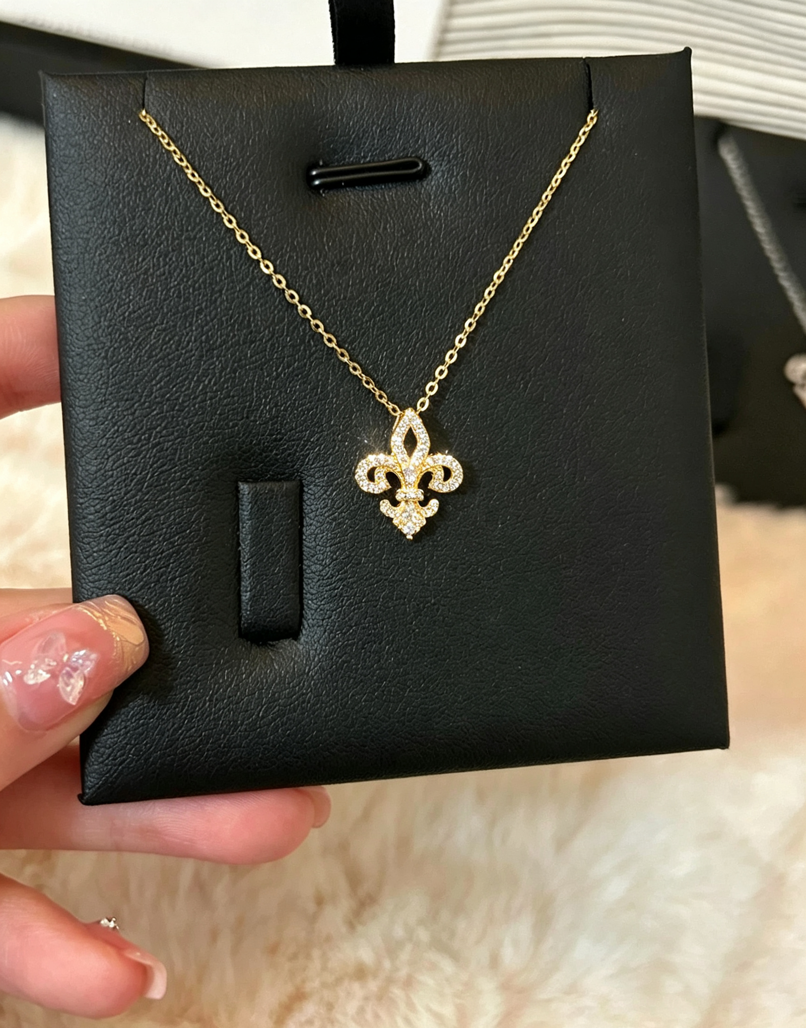 Gold Fleur de Lis necklace in 925 sterling silver with sparkling moissanite