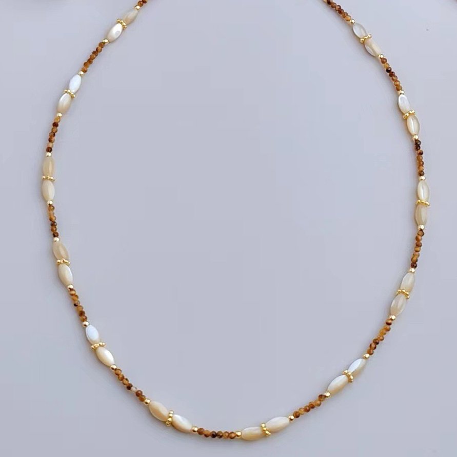 Natural tiger eye and mother of pearl necklace in a 42 cm beaded design