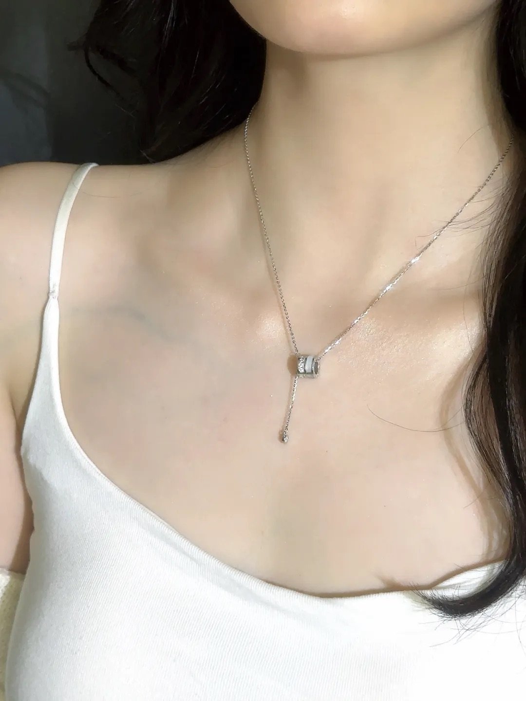 Mother of pearl moissanite necklace worn along the collarbone