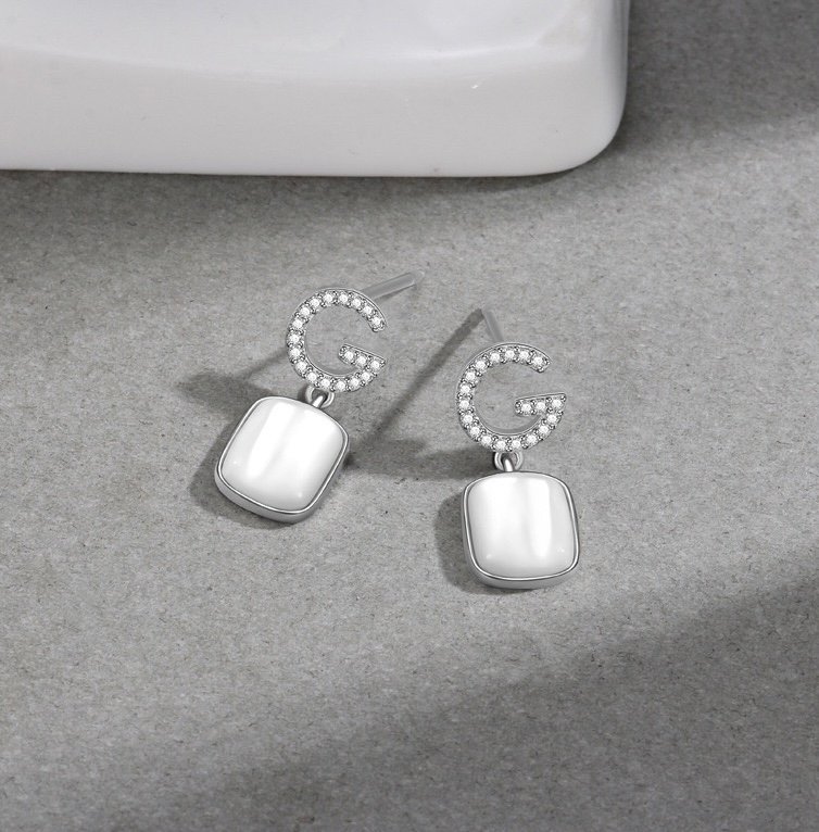 Front view of mother of pearl drop earrings in 925 sterling silver