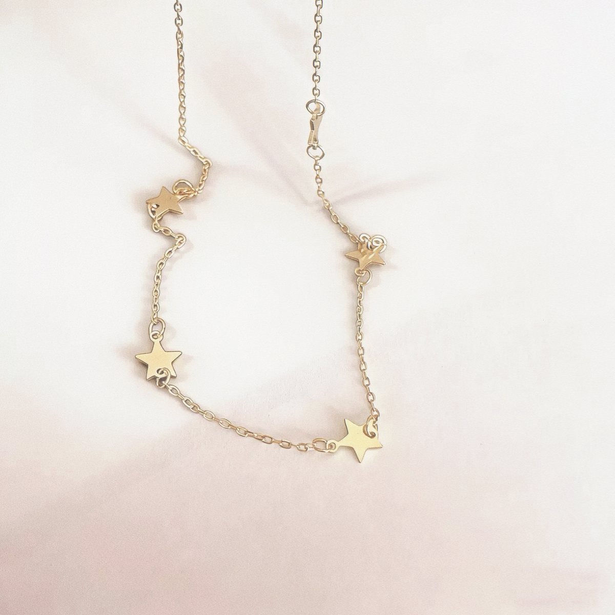 Sterling silver star necklace in gold with five-point star details