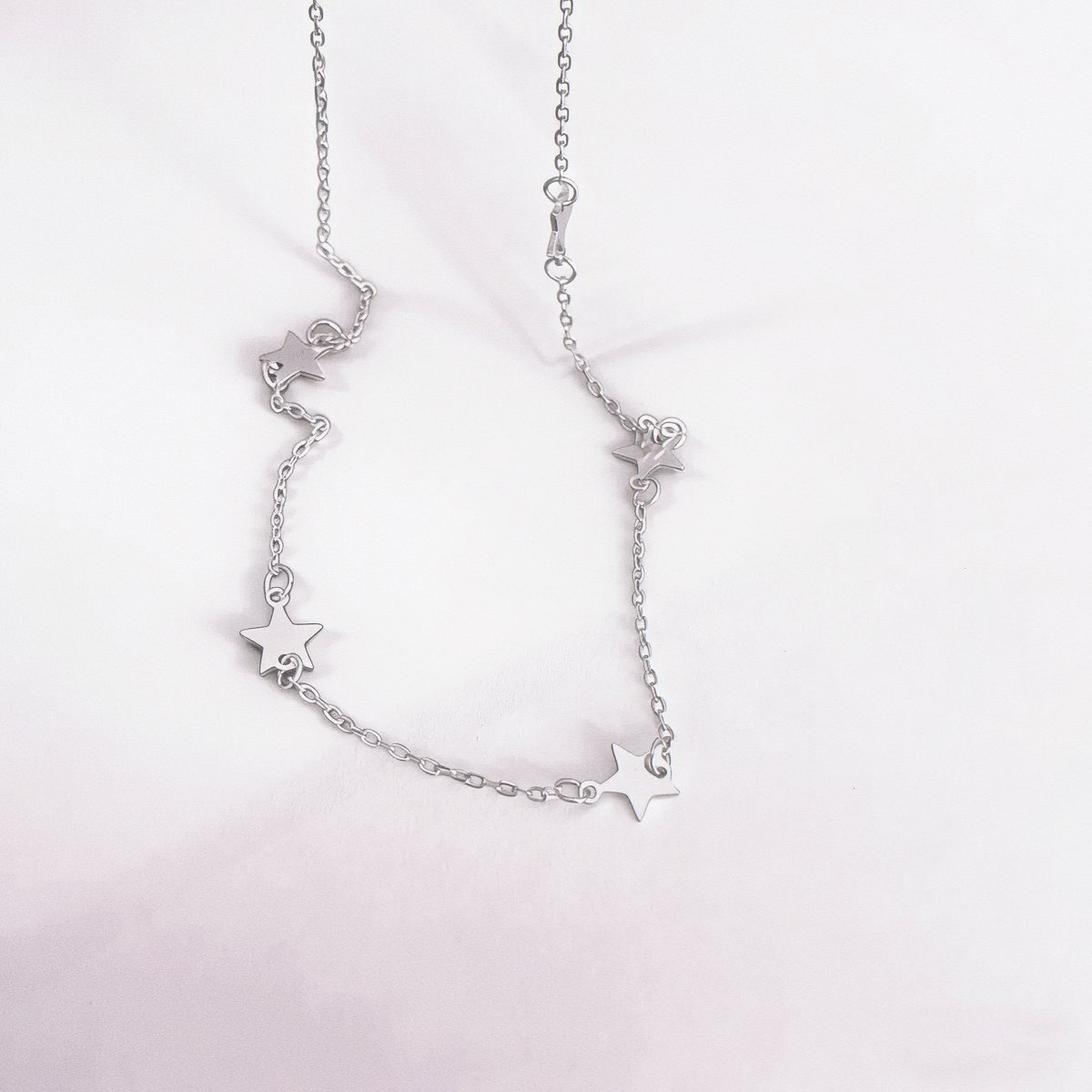 Sterling silver star necklace in silver with five-point star details