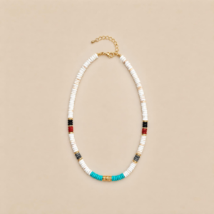 White beaded necklace with turquoise center and red and black accents