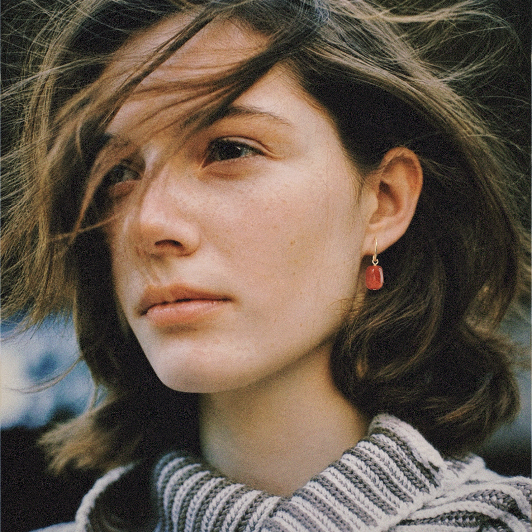 Woman wearing natural red Nanhong agate drop earrings