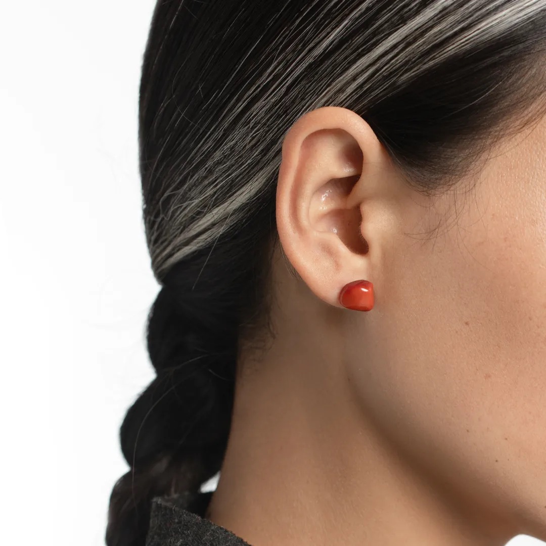 Close-up of Nanhong earrings worn on the ear