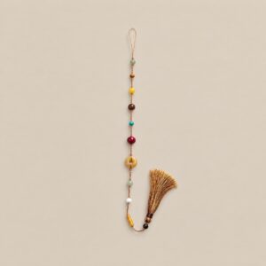 Free Spirit gemstone tassel charm in Coffee Brown with multicolored beads and a knotted tassel.