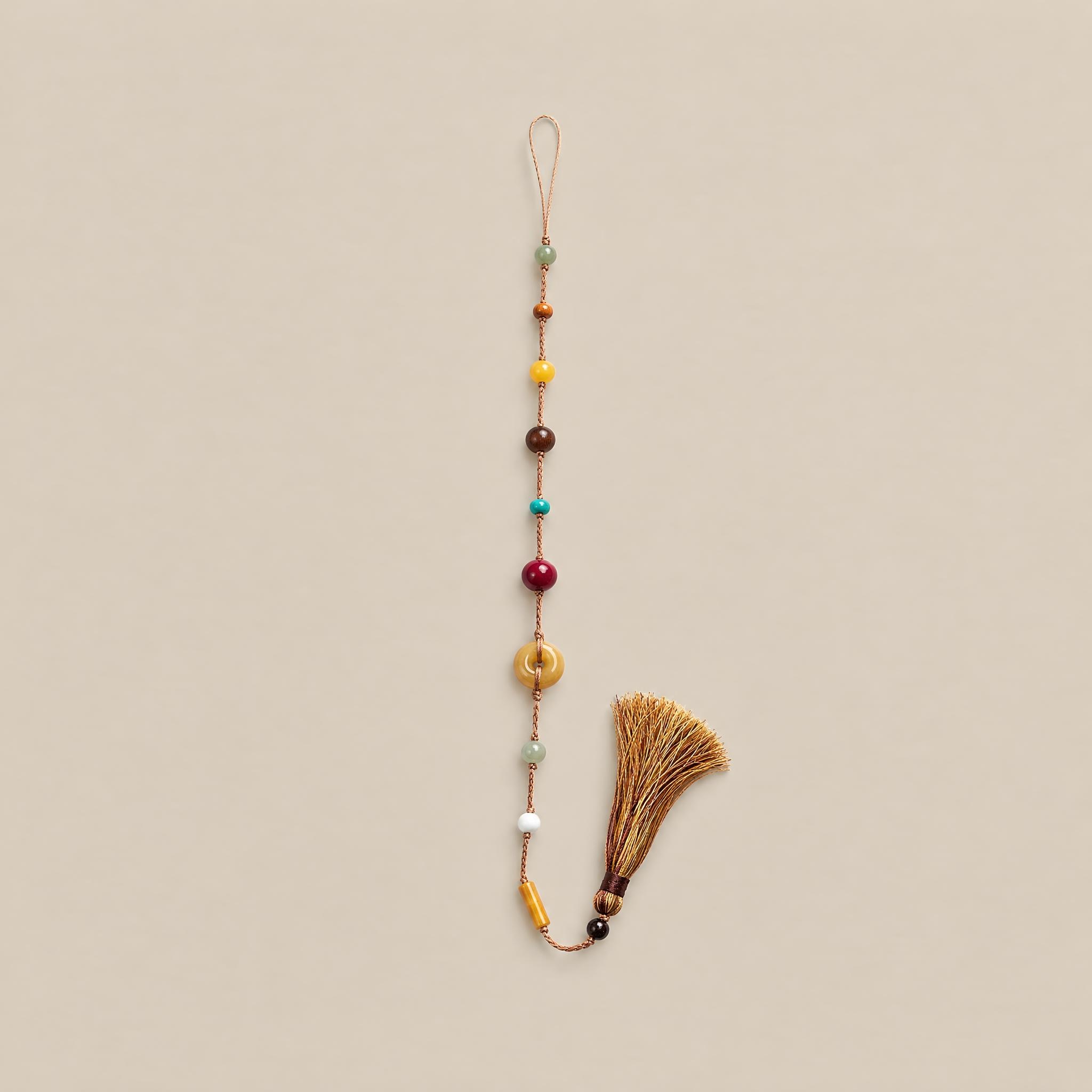 Free Spirit gemstone tassel charm in Coffee Brown with multicolored beads and a knotted tassel.