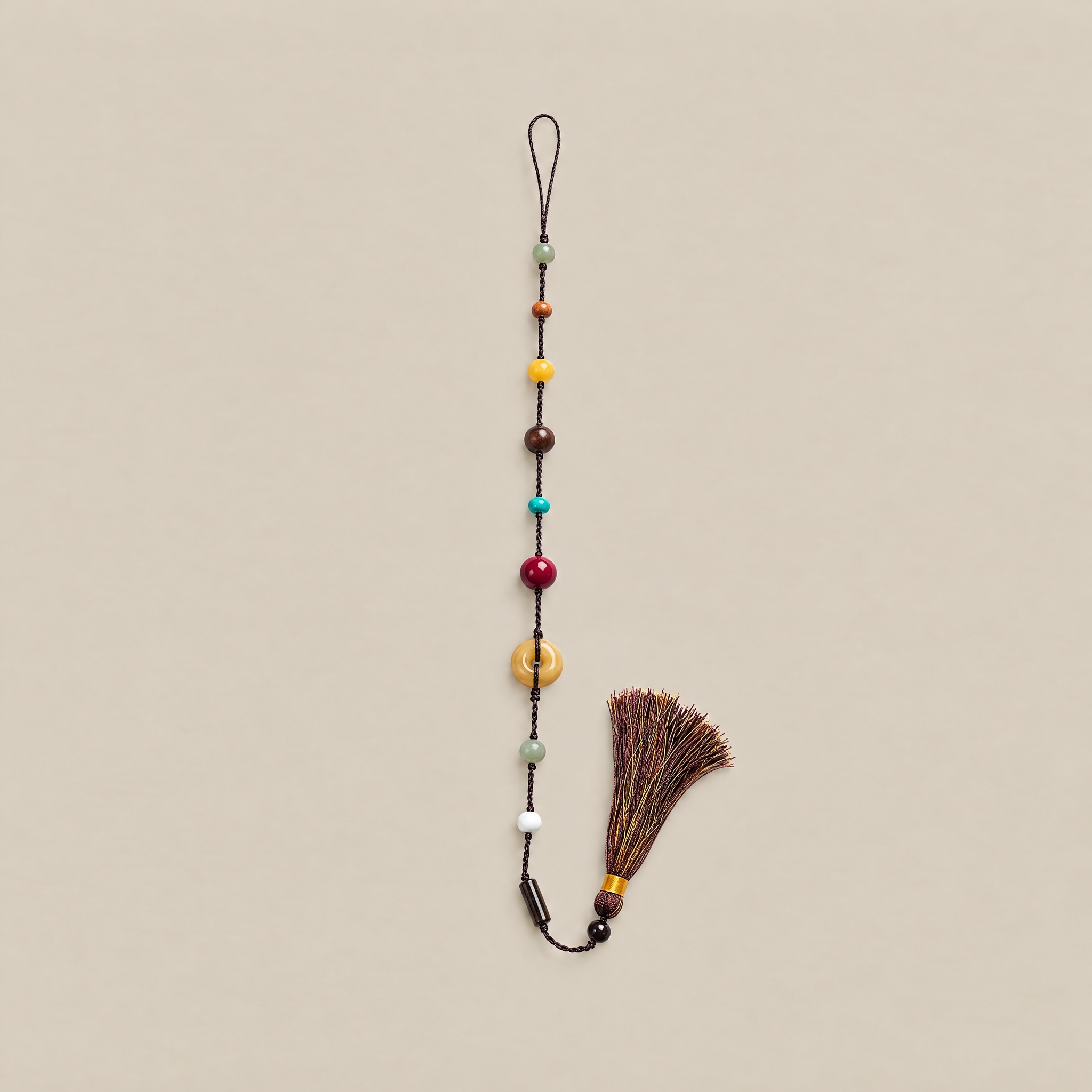 Free Spirit gemstone tassel charm in Dark Brown with colorful natural stone beads and a tassel.