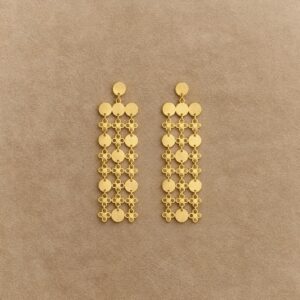Pair of matte gold-plated sterling silver fringe earrings with linked discs and open circular details on a beige background.