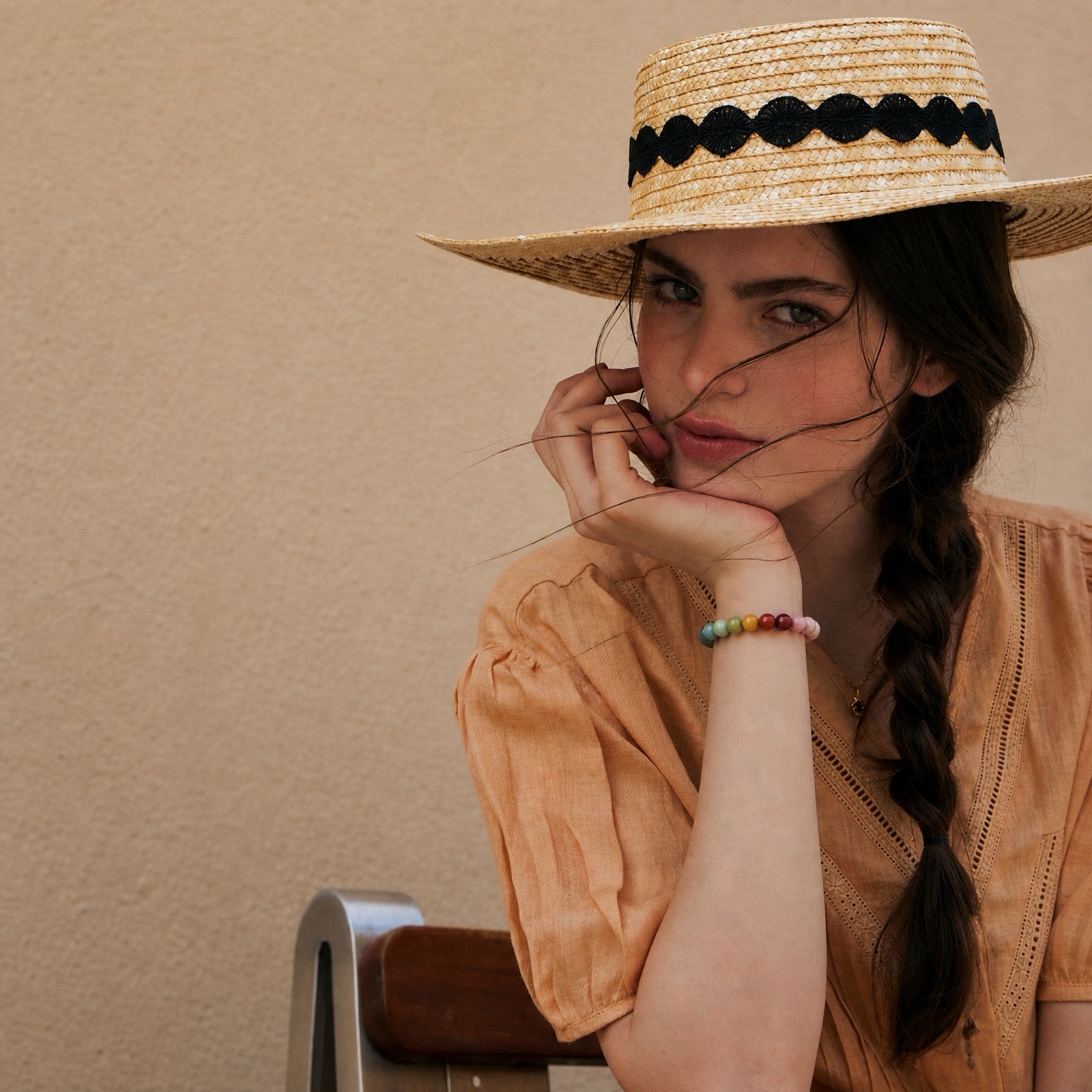 Woman wearing a colorful natural Alashan agate bracelet