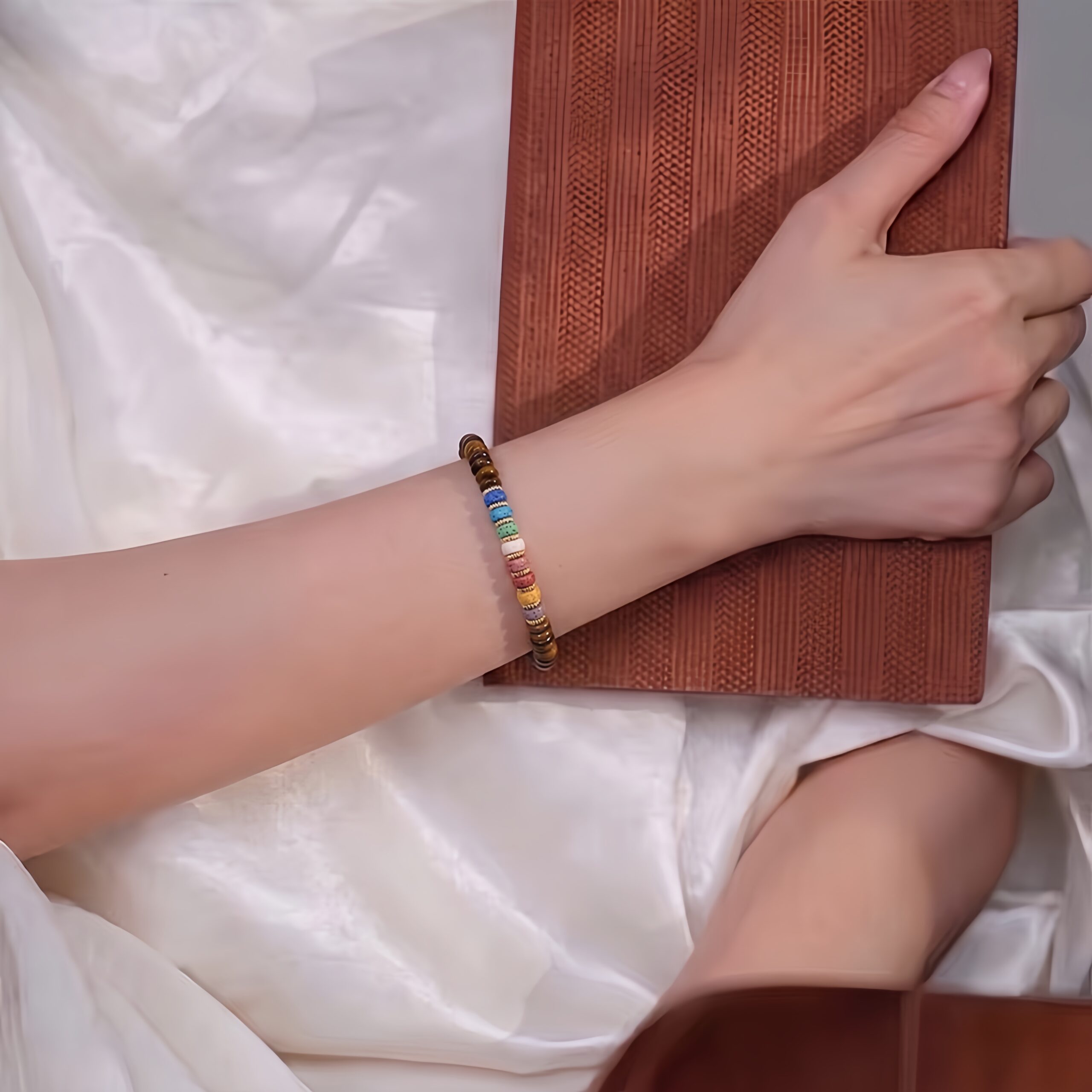 Tiger’s Eye Bracelet with colorful lava stone worn on wrist