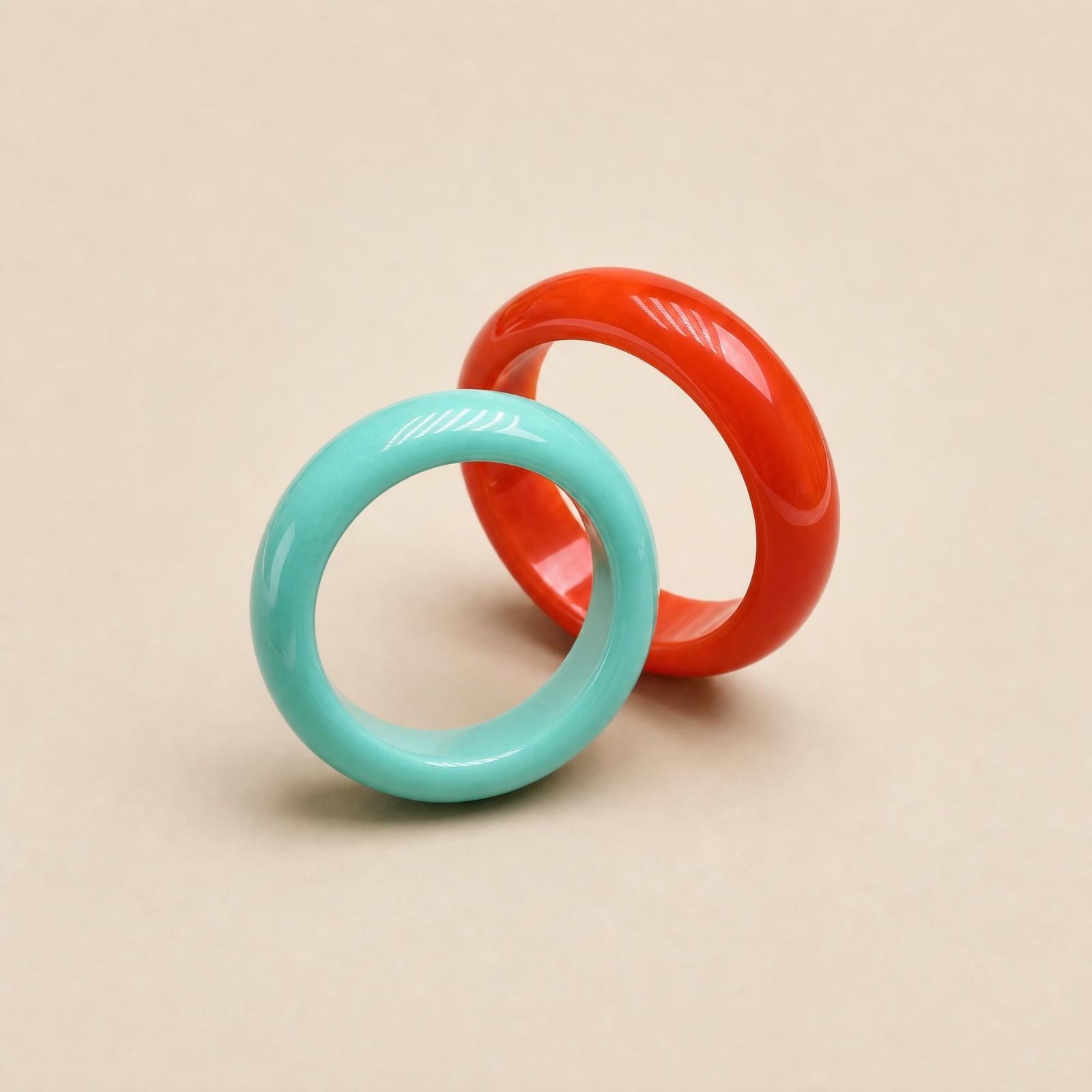 Nanhong agate and turquoise solid gemstone rings displayed together